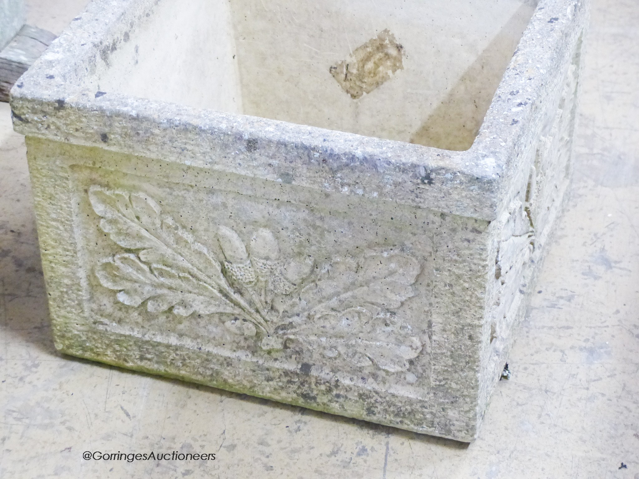 A set of four garden planters moulded with oak leaves and acorns, width 37cm, depth 37cm, height 27cm